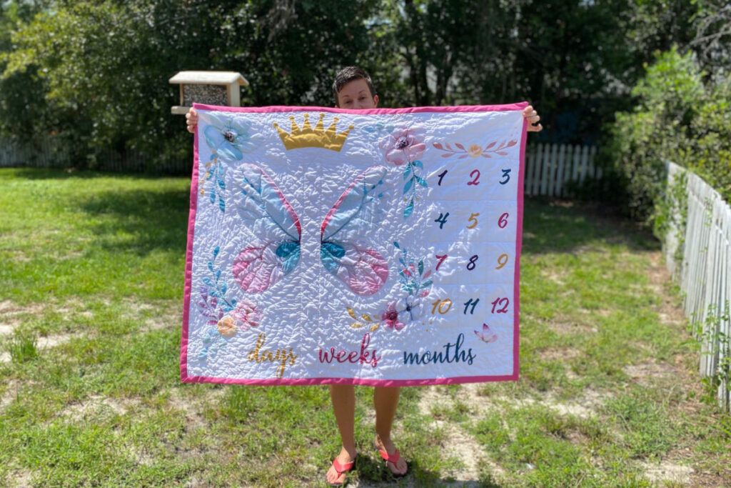 hand stitched watch-me-grow baby quilt